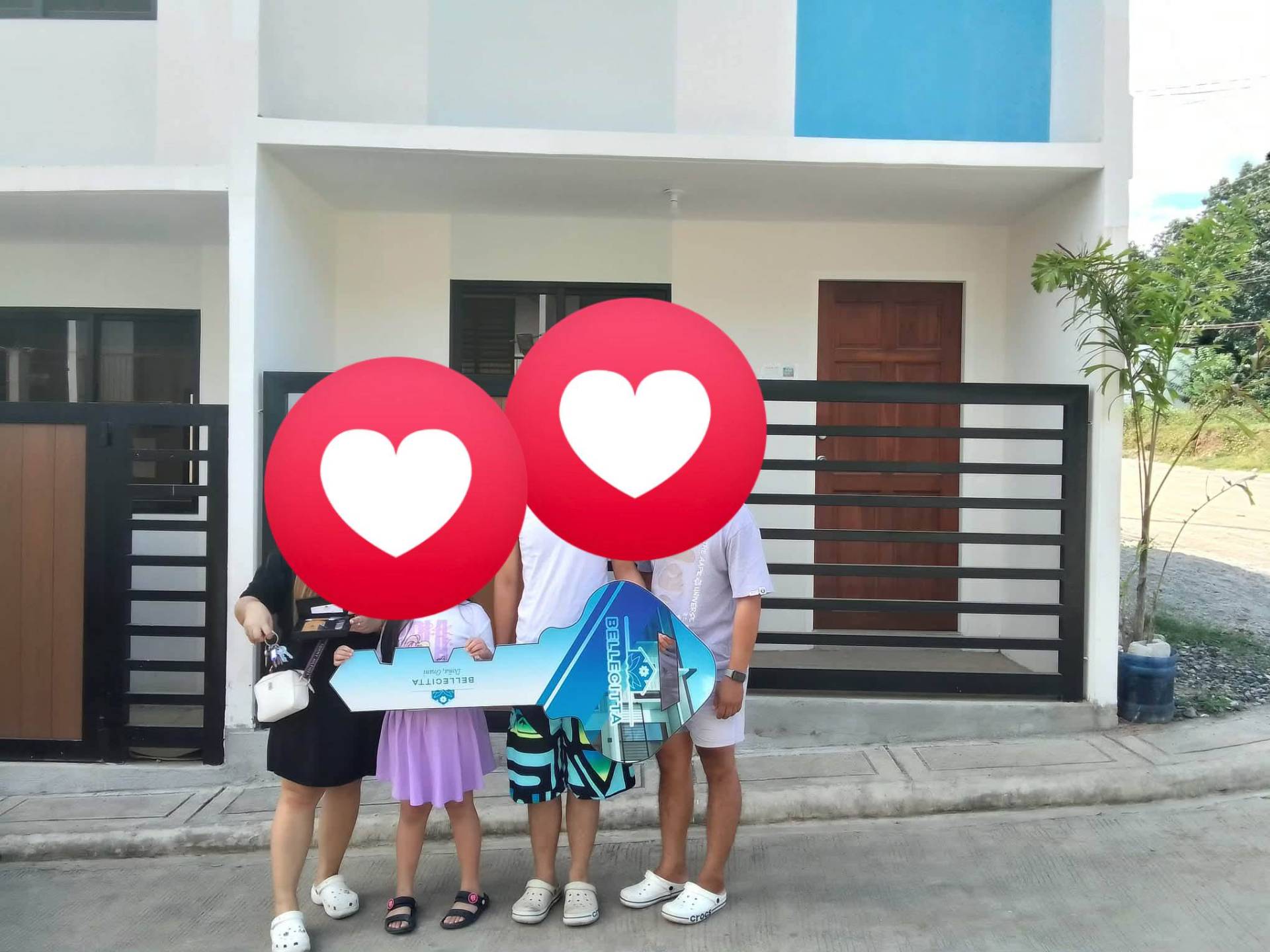 Happy Bellecitta homeowners receiving their keys